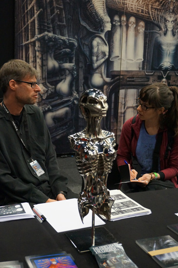 Kim talking to Marco Witzig at the H. R. Giger stall.